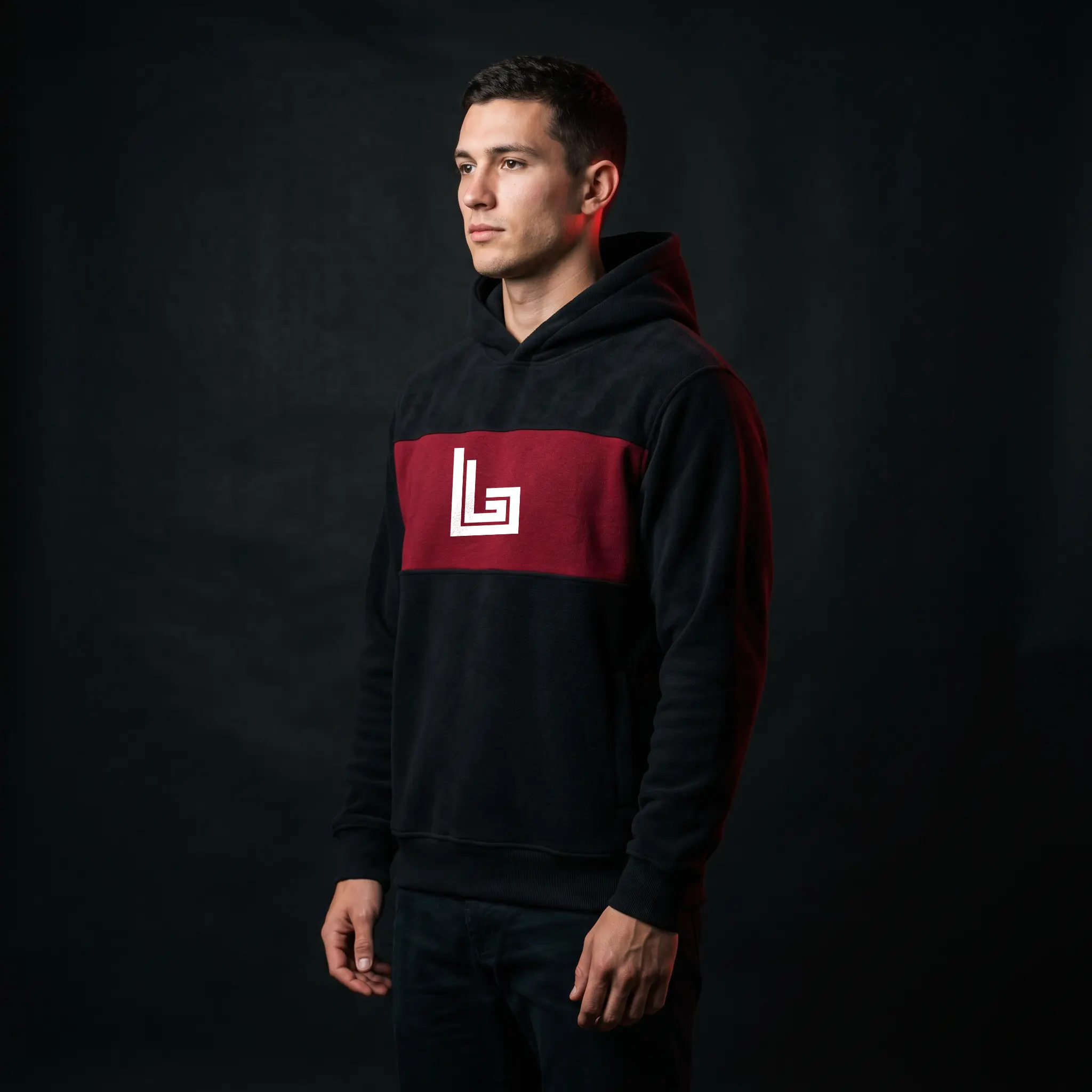 Custom fleece hoodie manufacturing in black and maroon with embroidered chest logo