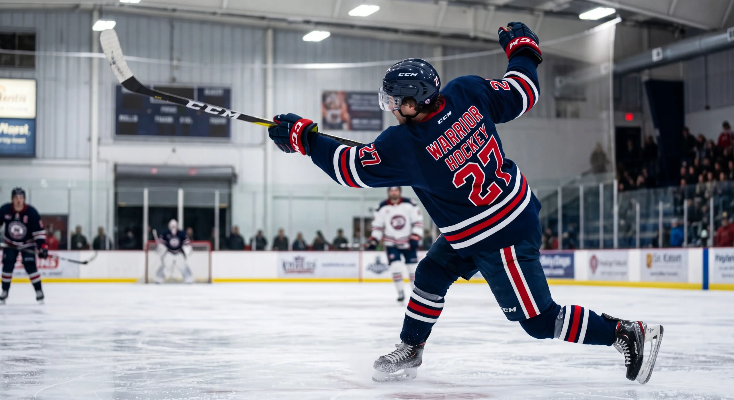 Hockey player in full extension reaching for a puck, demonstrating clear fabric ease around shoulders