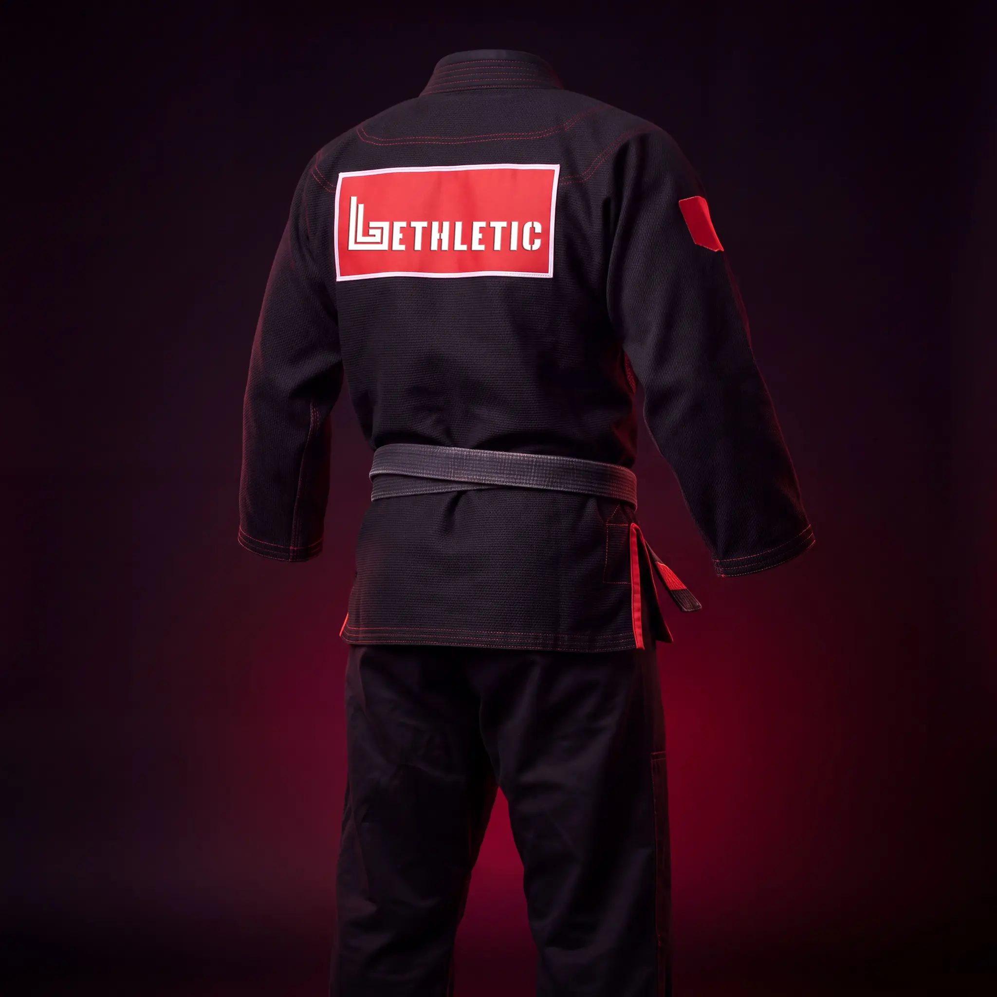 Custom BJJ gi with academy embroidery and back patch, ghost mannequin