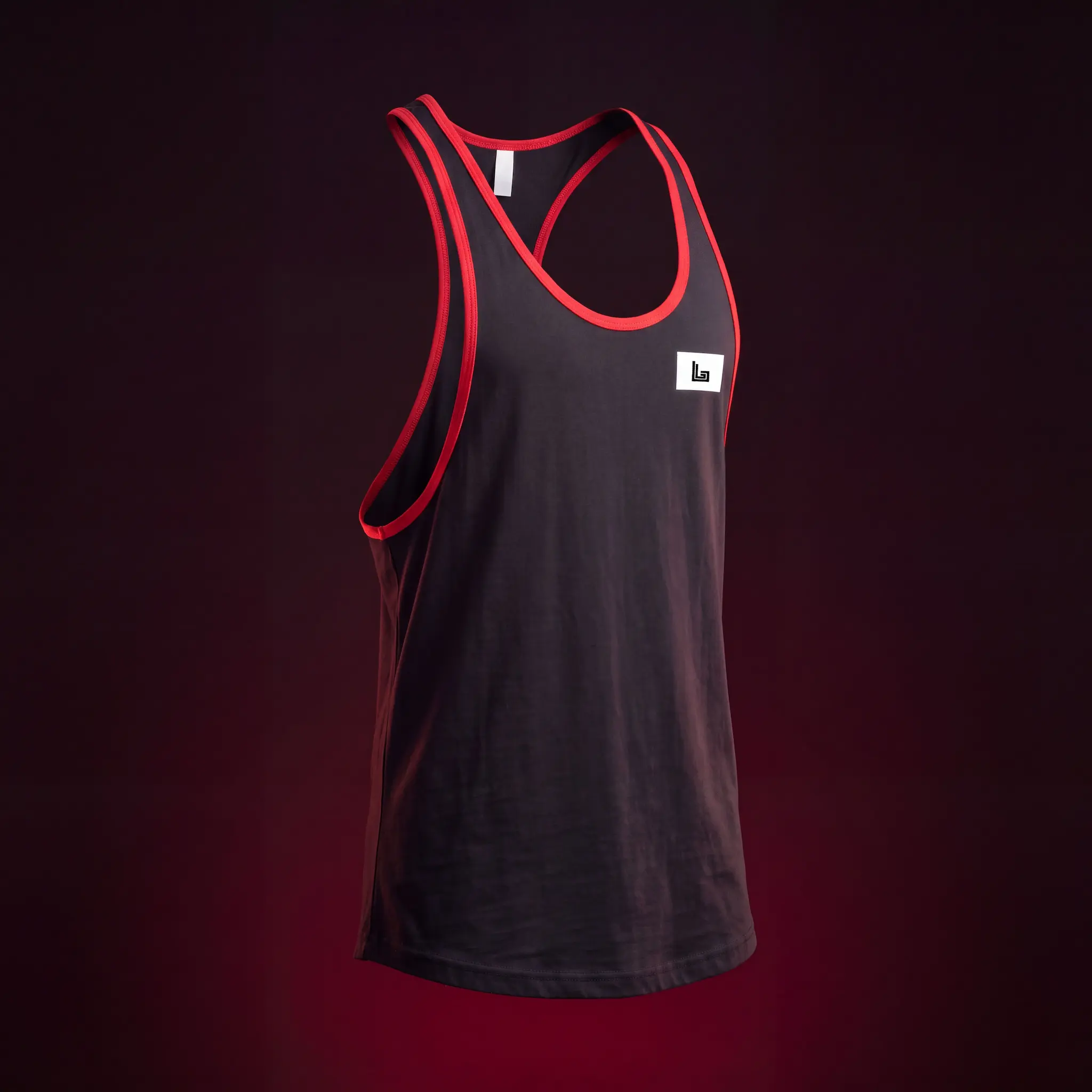 Bodybuilder in a custom stringer tank top with gym logo by Lethletic