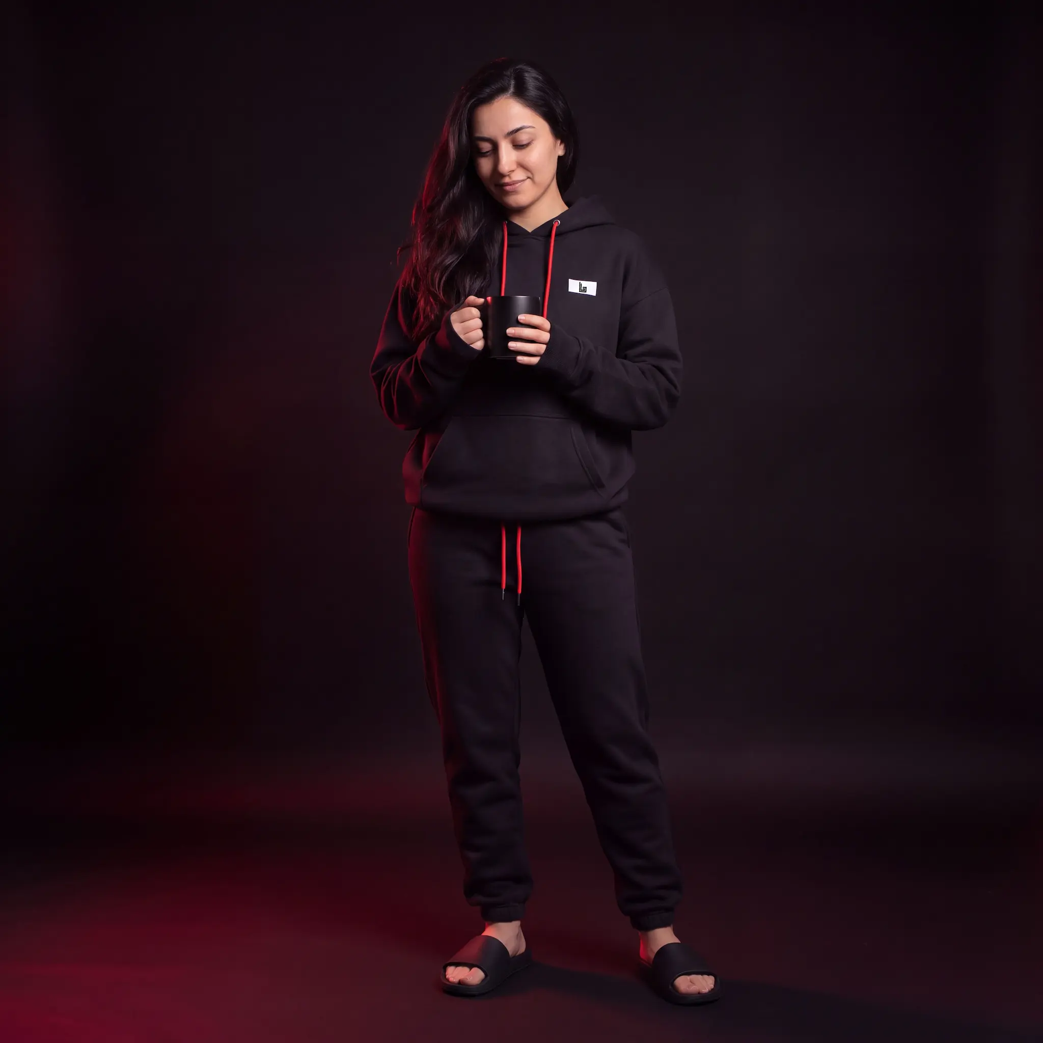 Custom loungewear manufacturer Lethletic: model in a matching cotton lounge set, hoodie and joggers