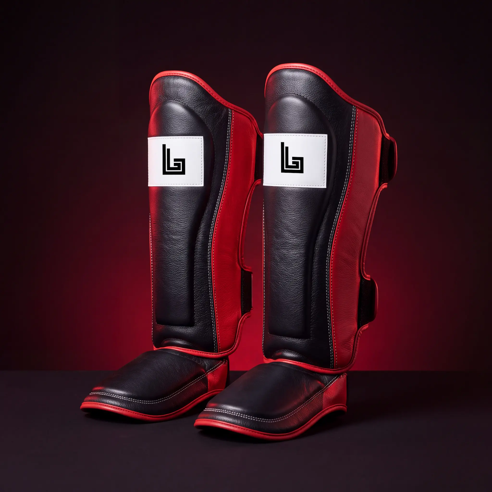 Custom Muay Thai shin guards with gym logo by Lethletic