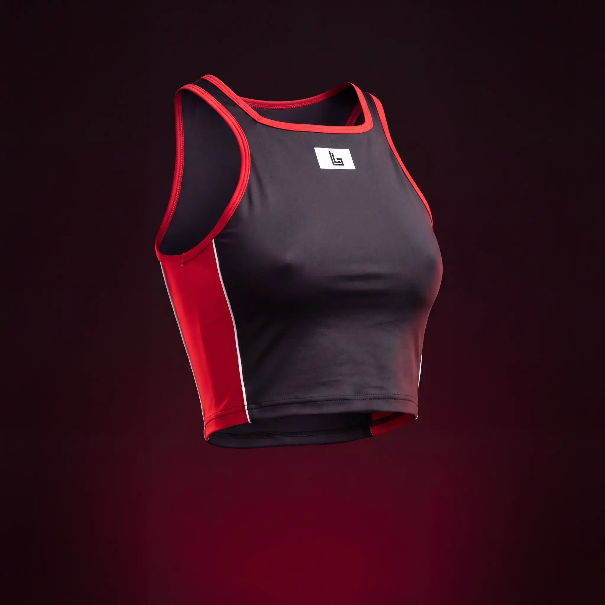 Custom rave crop top in black 4-way stretch fabric with red panels, made by Lethletic