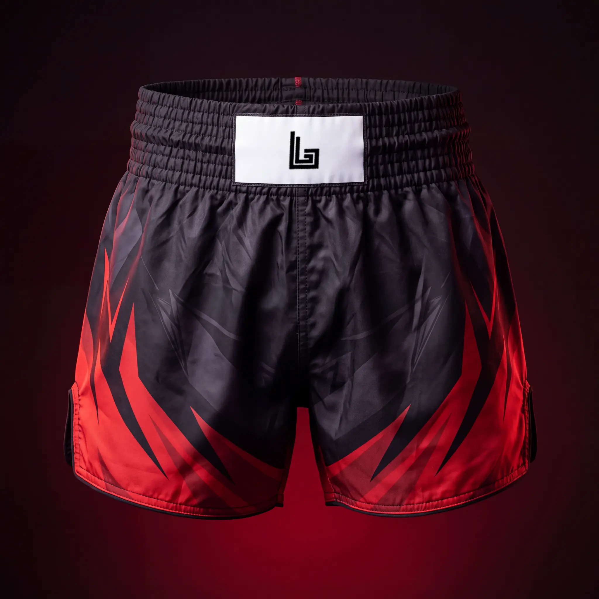 Custom sublimated polyester Muay Thai shorts with gym graphics by Lethletic