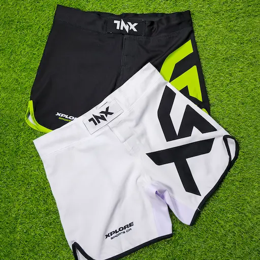 Custom black and white private label MMA shorts made for a fight brand by Lethletic