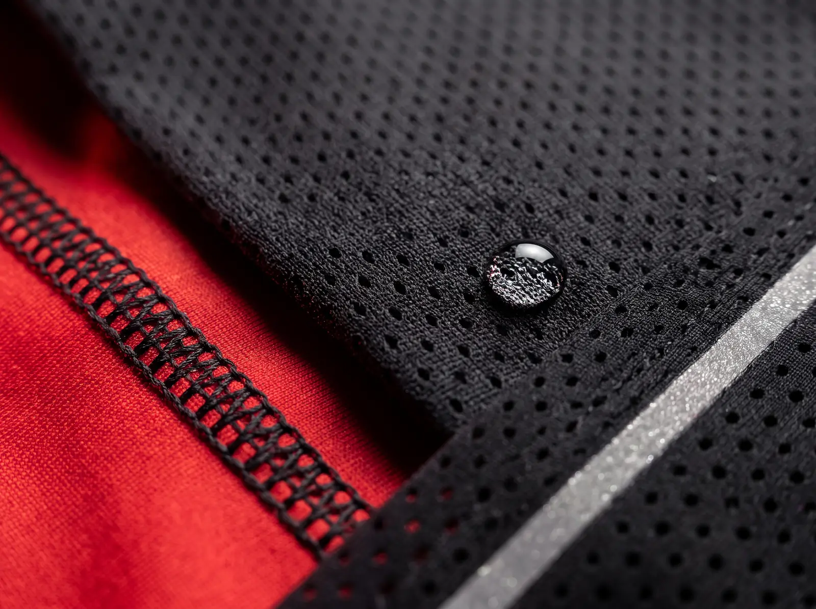 Close-up of custom running wear fabrics: micro-mesh and dry-fit polyester